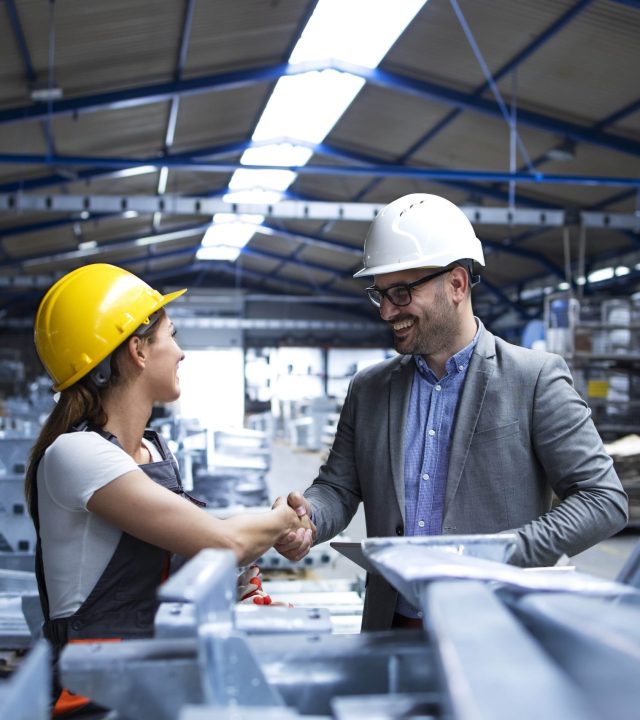 factory manager visiting production line congratulating worker promotion hard work good results min scaled